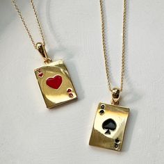 Get them solo or get the set! The set includes a playful pair of queen suited pendants, one for you and one for your bestie. The queen of hearts (♥) and queen of spades (♠) are neatly detailed in enamel. Pendants measure 15mm x 11mm. Chain is adjustable between 14" and 17.5". This is our grownup take on the classic friendship charm necklace and part of our BFF Charm Collection; tiny charms thoughtfully designed for you and your bestie. Each necklace in the two piece set is strung with a charm ha Best Friends Necklace, Gold Heart Pendant Jewelry For Best Friend, Queen Of Hearts Jewelry, Queen Of Hearts Necklace, Necklaces On Playing Cards, Heart-shaped Charm Necklaces For Best Friend, Queen Of Hearts Card Collar, Christmas Presents For Friends, Sun And Moon Necklace