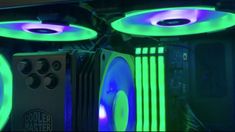 the inside of a computer case with neon lights on it's sides and two fans