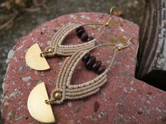 Garnet Macrame Earrings, Brass Marquise Half Moon Tribal Hippie Earrings, Beaded Bohemian Style Jewelry This statement hippie earrings are created using the macrame technique. It is made by a high quality tan waxed thread. Also, we use a Garnet chips beads and brass moon charms to complete design. Waxed thread gives the product durability and strength, and elegant natural appearance. It's a beautiful gift and a nice accessory what you can wear every day. Earrings characteristics: *Marquise brass Bohemian Adjustable Beaded Brass Earrings, Nickel-free Beige Bohemian Jewelry, Beige Teardrop Bohemian Jewelry, Bohemian Nickel-free Beige Jewelry, Bohemian Beige Teardrop Jewelry, Beige Bohemian Teardrop Jewelry, Bohemian Beige Teardrop Earrings, Bohemian Beige Macrame Jewelry, Bohemian Beige Dangle Jewelry