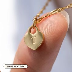 "Elevate your look with our High-Quality Heart Initial Tag Necklace - a timeless treasure for all! It's perfect for toddler girls and your mother. Materials & Finish: * 316L Stainless Steel * 14k Gold, Silver * Our products differ from regular gold plating because they are a thicker layer of 14k gold on 316L Stainless Steel, making them more durable. It offers the appearance and quality of gold jewelry at a more affordable cost. Size Specs: * Heart Initial Tag Dimensions:  10mm x 12mm * Chain Lengths: Available in multiple sizes (please select from the dropdown menu) * Necklace comes with a 2\" adjustable extender for fine-tuning. Link for just Charm: * https://www.etsy.com/listing/1325115090/add-on-gold-initial-pendant-add-letter Features: * Minimalist Personalized Design * Waterproof, Sw Valentine's Day Engraved Heart Pendant Initial Necklace, Everyday Heart-shaped Initial Necklace For Mother's Day, Personalized Heart-shaped Initial Necklace, Valentine’s Day Initials Pendant Necklace, Heart-shaped Initial Necklace For Valentine's Day, Engraved Heart Necklace, Initial Tag Necklace, Gold Initial Pendant, Letter Pendant Necklace