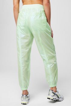 Sheer Ripstop Parachute Pant Fabletics green female Activewear >> Womens >> Bottoms >> Pants & Joggers >> Lounge Pants Nylon Ripstop regular Everyday External Pocket Shiny Sportswear, Nylon Outerwear, Parachute Trousers, Silhouette Mode, Female Activewear, Parachute Pant, Gym Wear For Women, Fashion Silhouette, Shiny Pants