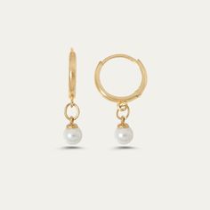 Pearl Drop Earrings in 14k solid gold, handcrafted in Europe. These earrings are perfect to wear all the time and add a touch of elegance to any stack. * Hoop diameter 12mm * Hoop width 2.5 mm * Pearls, 4.3 mm Minimalist Pearl Drop Huggie Earrings As Gift, Minimalist Pearl Huggie Earrings, White Minimalist Pearl Huggie Earrings, Minimalist Huggie Earrings With Pearl Charm, White Minimalist Huggie Pearl Earrings, Minimalist Pearl Drop Small Hoop Huggie Earrings, Everyday Pearl Drop Huggie Earrings, Delicate Huggie Hoop Earrings With Pearl Charm, Minimalist Huggie Pearl Earrings For Wedding