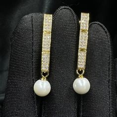 Add a touch of timeless elegance to your jewellery collection with this stunning white pearls earrings. Materials: 8mm shell pearls, gold or platinum plated brass earrings with inlaid zircon. Shell pearls are made from crushed shells. Oyster shells are cut and transformed into powder and then reformed into perfect pearl shape with an infinite shine.  They are very popular as a natural alternative to expensive pearls.  Matching choker here: https://perlettejewellery.etsy.com/listing/1748630709 Ma Anniversary Pearl Bridal Earrings With Diamond Accents, Elegant Cubic Zirconia Diamond Earrings With Pearl Drop, Elegant Diamond White Pearl Bridal Earrings, Pearl-embellished Cubic Zirconia Drop Earrings, Pearl White Cubic Zirconia Pearl Earrings For Evening, Elegant Gold Plated Diamond Earrings With Accents, Evening Bridal Earrings With Pearl Drop And Cubic Zirconia, White Pearl Bridal Earrings With Diamond Accents, Gold Pearl Earrings With Diamond Accents And Cubic Zirconia