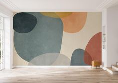 an empty room with a large wall mural