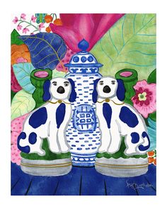 two dogs sitting next to a blue and white vase