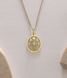 Gold Moon Pendant - Moon Phases Gold Necklace ● Material of pendant: Solid Gold 14k ( REAL GOLD ) ● Metal Stamp: 14k ( REAL GOLD ) ● The pendant is available in 5 sizes: - 12x17 mm / 0,47 x 0,66 inches - 13x18 mm / 0,51 x 0,70 inches  In the photos - 14x19 mm / 0,55 x 0,74 inches  - 16x21 mm / 0,62 x 0,82 inches  - 18x24 mm / 0,70 x 0,94 inches ( In the photos the size is 13x18 mm / 0,51 x 0,70 inches ) ( Jump Ring inner diameter: 4 mm ) ● Material of chain: Solid gold 14k ( REAL GOLD ) It is thin and dainty and it is available in 4 sizes: - 40 cm / 15,75 inches ( Length ) - 45 cm / 17,72 inches ( Length ) In the photos - 50 cm / 19,68 inches ( Length ) - 55 cm / 21,65 inches ( Length ) ● Backside engraving is FREE ( Please use the personalization box for that.) ● If you want larger size, Moon Shaped Brass Necklace For Gift, Moon-shaped Brass Necklace For Gift, Moon Phase Necklace, Gold Engraved Moon-shaped Jewelry, Moon-shaped Yellow Gold Necklaces With Charms, Gold Moon-shaped Engraved Jewelry, Yellow Gold Moon-shaped Necklaces With Charms, Yellow Gold Moon Necklaces With Charms, Oval Pendant Jewelry With Moon Charm As Gift