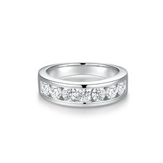 a white gold wedding ring with five diamonds on the side and channel set in the middle