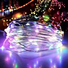 colorful lights are on the ground in front of a staircase