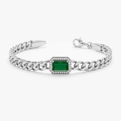 Juliet Embrace bold opulence with the Emerald & Diamond Cuban Bracelet. This exquisite piece showcases a stunning interplay of vibrant emeralds and dazzling diamonds, expertly set within the gleaming links of a 14k solid gold Cuban chain. The emerald's captivating green hues contrast beautifully with the diamonds' fiery sparkle, creating a truly luxurious statement piece. - Handmade- Solid Gold- Natural Diamonds and Emerald - G Color, SI Quality Diamonds- Total Diamond Carat Weight: 0.08 ctw- To Modern Formal Emerald Jewelry, Elegant Cuban Link Chain Bracelet With Diamond Cut, Elegant Diamond Cut Cuban Link Chain Bracelet, Elegant Cuban Link Diamond Cut Bracelets, Cuban Link Diamond Accent Formal Bracelet, Emerald White Gold Bracelet, Modern Green Cubic Zirconia Jewelry, Green Diamond Bracelet For Formal Occasions, Formal Silver Diamond Bracelet With Emeralds