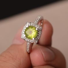 This is a gorgeous handmade creation. Its beauty is its simplicity & Elegance. The 7*7mm round cut natural peridot is crafted in solid sterling silver and with rhodium plated. It is available to customized, if you have any mind, just let me know, we will discuss with it. All item is sent in a beautiful gift box You can realize more lovely stuff clicking the link https://www.etsy.com/shop/knightjewelry?refshopsection_shophome_leftnav Please leave the correct address and you PHONE NUMBER for d Peridot Birthstone Diamond Ring Fine Jewelry, Peridot Center Stone Jewelry For May Birthstone, Peridot Ring Gemstone Gift, Peridot Gemstone Ring Gift, Elegant Peridot Crystal Ring As A Gift, Anniversary Peridot Birthstone Ring With Gemstone, Peridot Gemstones For Anniversary - May Birthstone, Lime Green Peridot Birthstone Ring For Promise, Peridot Gemstones Birthstone For Anniversary