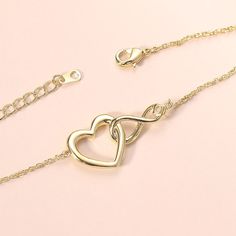 ✦ Show your eternal love with the Infinity Heart Pendant Necklace! No matter the relationship, this exquisite necklace celebrates the endless joy of love. The heart and infinity symbols combined represent never-ending devotion, while the inlaid clear zircon signifies purity and tranquility. Always express your unwavering love for your special someone with this stunning necklace. ----------- DETAILS ----------- - Materials: 925 Sterling Silver, Cubic Zirconia - Necklace Length: 40cm + 5cm - Pendant Size: 0.6*0.9cm - SKU:YS127 Cubic Zirconia Infinity Jewelry For Mother's Day, Infinity Cubic Zirconia Necklace For Mother's Day, Mother's Day Infinity Necklace With Cubic Zirconia, Mother's Day Cubic Zirconia Infinity Necklace, Elegant Heart Shaped Bracelets For Anniversary, Elegant Open Heart Bracelet For Anniversary, Elegant Double Heart Jewelry For Her, Elegant Double Heart Jewelry As Gift For Her, Elegant Double Heart Jewelry Gift For Her