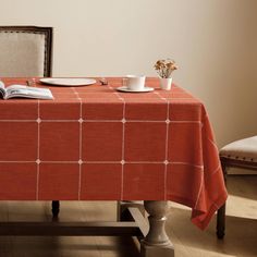 an orange table cloth with white squares on it