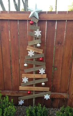 a christmas tree made out of wooden planks