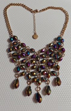 Liz Claiborne Vintage Gold Tone/Faceted Iridescent Bead Statement Necklace. This Lovely Bib Statement Necklace By 'Liz Claiborne' Measures '17' Inches In Length (+@ '2' Inch Extender) With Gold Tone Hardware Starting Off With A Beautiful Rolo Chain That Presents A Gorgeous Bib Design Of Faceted Iridescent Beads That Just Shine With A Teardrop Bead Ending That Is So Very Pretty! Signed 'Liz Claiborne Est 1976' & 'Lc' Brand Tag Near Clasp. A Beautiful Piece! Excellent Condition! Never Worn! (See P Metal Beaded Necklaces With Faceted Beads For Party, Metal Beaded Necklace With Faceted Beads For Party, Metal Beaded Necklace With Dangling Beads For Party, Party Beaded Necklaces With Faceted Metal Beads, Metal Necklaces With Faceted Beads For Parties, Party Beaded Necklace With Large Metal Beads, Party Necklaces With Faceted Metal Beads, Iridescent Crystal Necklaces For Party, Elegant Iridescent Necklace For Parties