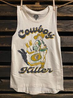 Country Deep Cowboy Killer cotton muscle tank MUSCLE CROP SIZING Sizing Model is wearing a size Small. Height is 5'6", bust 33", waist 26", and hips 36" Size S: Length measures 19” from shoulder to hem with a 19” bust Size M: Length measures 19.5” from shoulder to hem with a 19.5” bust Size L: Length measures 20” from shoulder to hem with a 20” bust 90 percent ring-spun cotton/12.5% rayon Side-seamed Relaxed, drapey fit Low cut armhole Curved bottom hem Sizes: S-XL Cowboy Killer, Vintage Muscle, Muscle Tank Top, Muscle Shirts, Muscle Tank Tops, Music Festivals, Muscle Tank, Muscle Tanks, Low Cut