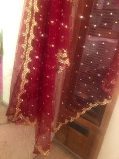 More dupatta here in our collection https://www.etsy.com/shop/neelcreations/?section_id=15880219This Dupatta is sequin embroidered on net with beautiful golden border scallop. This can we your wedding dress chunni for Indian occasion wear for festival. This has perfect bling for you to look classy and ethnic at same time. This can even be your home decoration fabric for you can even wear them with lehenga.***This can be made in any color. ***We can even make a jacket or poncho out of this. NOTE Red Chanderi Choli With Dabka Work, Festive Red Sharara With Sheer Dupatta, Red Traditional Wear With Sheer Dupatta, Red Organza Saree With Zari Work, Red Anarkali Set With Dupatta In Chinon, Traditional Red Salwar Kameez With Sheer Dupatta, Red Traditional Wear With Sheer Dupatta And Kundan, Red Kundan Sharara With Dupatta, Red Organza Traditional Wear For Eid