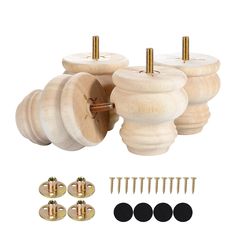 three wooden knobs and four screws with brass plated hardware on a white background