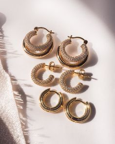 Double down on your earring game. Miles is the unexpected twist on the 14k gold plated classic hoop you didn't know you needed in your everyday earrings. Her peekaboo pave second hoop is playfully perfect and lightweight enough for daily wear. - Double tube pave hoop earrings- Hoop measures approx 22mm - 14k gold plated brass - Sterling silver post- Cubic zirconia pave accents Disco Earrings, Chic Closet, Double Down, Earrings Hoop, The Unexpected, Everyday Earrings, Daily Wear, Cubic Zirconia, Gold Plate