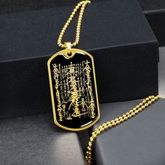 "This Nam Myoho Renge Kyo Necklace Is the Perfect Gift Whether for Yourself or a Loved One.  Explore all our Inspirational jewelry here: https://www.etsy.com/in-en/shop/SymbolicPresent?ref=seller-platform-mcnav§ion_id=31033166 ➜ Our jewelry is made of high-quality surgical steel with a shatterproof liquid glass coating and an 18k gold finish option. ➜ Engrave onto the back of the Nam Myoho Renge Kyo pendant your loved one's name, your wedding date, an anniversary, or anything else you want to re Nam Myoho Renge Kyo, Ganesh Pendant, Talisman Necklace, Inspirational Jewelry, Glass Coating, Gold Engraving, Mystery Book, Wedding Date, Ball Chain