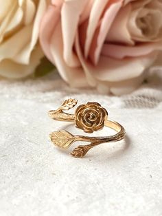 Please Read   Photos are enlarged to show detail. Please read the measurement in the description. ☑️ The gold ring is Bronze and adjustable. ♥️ Follow us and like us on Instagram for discount codes and new designs @mathewandmarieco Floral Gold Ring, Adjustable Rose Design Rose Gold Ring, Elegant Adjustable Flower Ring With Roses, Adjustable Elegant Rings With Roses, Elegant Adjustable Rings With Roses, Elegant Adjustable Rings With Rose Details, Dainty Rose Gold Ring With Rose Design, Dainty Rose Design Rose Gold Ring, Adjustable Rose Design Flower Ring As Gift