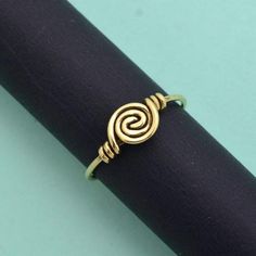 Cute spiral ring of Brass, handcrafted and lightweight. Stack with other gemstone rings, or wear it alone.❥ The spiral is one of the oldest symbols in the world. It appears in most ancient cultures across the globe and has many meanings, including progress, direction, and expansion. The Greeks related spirals to infinity, balance, and awareness.❥ Benefits of Brass Metal :Brass has metaphysical healing properties to boost the immune system and to give courage.It's known to help reduce inflammatio Black Obsidian Ring, Obsidian Ring, Old Symbols, The Greeks, Transparent Nails, Metaphysical Healing, Spiral Ring, Black Obsidian, Ancient Cultures