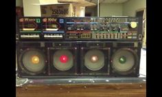 an old stereo system sitting on top of a wooden table