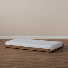 a mattress on the floor in an empty room