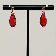 "- Stunning \"Scarlet Letter\" Red Swarovski Faceted Briolette Teardrop 17mm Crystal Earrings with 14K Gold Filled Connector Rings and 14K Gold Filled Posts or Studs with 4mm Ball Ends. Backs included. See Photos #1-3. - Stunning Scarlet Red shade from Swarovski Faceted Crystals in Austria. - 17 x 8.5mm size, or 5/8 x 1/4\", Crystal measurement. - Drop Length 3/4\". - 14K Gold Filled Jump Ring Connectors. - 14K Gold Filled Posts (Studs) with 4mm Ball Ends and Backs. - See 14K Gold Filled Bali Ho Red Hypoallergenic Jewelry For Formal Occasions, Hypoallergenic Red Jewelry For Formal Occasions, Formal Red Hypoallergenic Jewelry, Red Drop Earrings For Formal Occasions, Classic Red Pear-shaped Jewelry, Red Faceted Earrings For Formal Occasions, Red Faceted Earrings For Anniversary, Faceted Teardrop Red Jewelry, Red Drop Jewelry For Formal Occasions