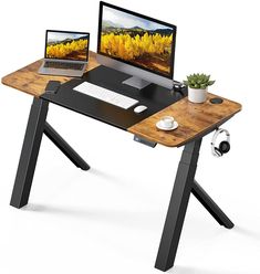 a computer desk with a laptop and monitor on it, sitting next to each other