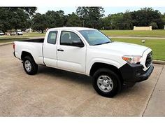 a white truck parked in a parking lot