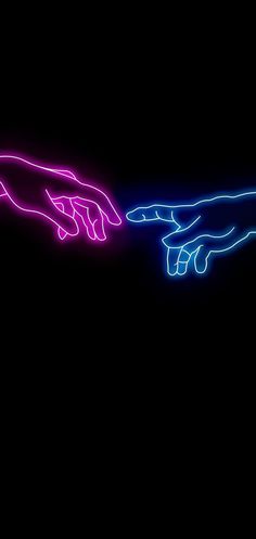 two hands touching each other with neon lights