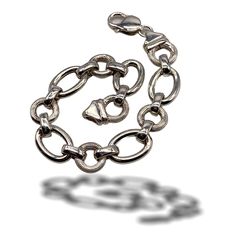 Gorgeous bracelet, 1980 Italian A  elegant 925 silver chain Elegant large chain: round links with  texture  polished and grooved,  oval links with shiny texture and smooth, alternating with small oval  shiny silver links A timeless jewel of great value and suitable to be worn by Bride Chic The bracelet is 19.5 cm in length (7.60inch)., High cm.1.2 (0.48inch). weighs 17.40gr. in very good condition Shipping from Italy to the rest of the world: please note that shipping costs are related to domest Classic Silver Chain Metal Bracelet, Classic Silver Chain Link Charm Bracelet, Classic Silver Metal Chain Bracelet, Classic Silver Chain Charm Bracelet, Classic Silver Chain Link Bracelet, Classic White Gold Charm Bracelet With Silver Chain, Classic White Gold Metal Chain Bracelet, Sterling Silver Bracelet With Solid Oval Links, Sterling Silver Chain Bracelet With Solid Link