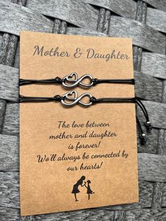 A Mother-Daughter bond is a bond that cannot be broken 👭 Our adorable mother and daughter bracelet set is perfect as a gift or for you to share with your mother or daughter :) A special way for you to think of each other- even when you are apart! 💕 Material - Made of High-Quality Nylon Black Cord and heart charms 💕 Adjustable Size - The length is 4"-11", you can adjust the size through a sliding knot to fit even the largest or smallest of wrists 💕 Heart charms - A little way for you to think Meaningful Bracelet For Anniversary And Mother's Day, Adjustable Jewelry For Anniversary And Mother's Day, Adjustable Jewelry For Mother's Day Anniversary, Mother's Day Double Heart Adjustable Charm Bracelet, Personalized Friendship Bracelets For Father's Day, Mother's Day Adjustable Double Heart Charm Bracelet, Meaningful Adjustable Jewelry For Mother's Day, Mother's Day Double Heart Friendship Bracelet, Adjustable Meaningful Jewelry For Mother's Day