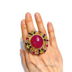 Cluster Multi Color Fancy Gems from Sri Lanka Ruby - 12 Carat Amethyst - 3 Carat Peridot - 2 Carat Blue Topaz - 2 Carat Citrine 3 Carat White Topaz - 1 Carat  This Ring is from the "Orient" traveling collection are the epitome of elegance and versatility. It offers a perfect blend of day to night and swimwear to evening wear, allowing you to effortlessly transition between different occasions and outfits. Wearing these spectacular oriental-style ring will undoubtedly make you the center of atten Elegant Multicolor Cabochon Gemstones, Luxury Multi-stone Ruby Ring, Luxury Handmade Ruby Ring, Luxury Multicolor Ruby Ring, Luxury Multi-stone Rings For Party, Fine Jewelry Multicolor Cabochon Gemstones, Multicolor Cabochon Gemstones Fine Jewelry, Multicolor Cabochon Gemstones For Fine Jewelry, Luxury Multicolor Amethyst Ring With Gemstone Accents