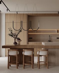 a kitchen with wooden cabinets and white stools