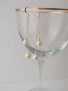 Long double pearl sterling silver drop earrings. Freshwater pearl earrings Pretty white freshwater pearl drop earrings. All parts sterling silver. Long pearl earrings. Dangly pearl earrings. Elegant Drop Pearl Earrings, White Long Drop Jewelry With Pearl Charm, Silver Round Pearl Chain Earrings, Silver Pearl Chain Earrings, Elegant White Long Drop Pearl Earrings, Elegant Sterling Silver Pearl Earrings With Pearl Chain, Sterling Silver Pearl Chain Earrings In Pearl White, Silver Pearl Minimalist Earrings, Minimalist Silver Pearl Earrings