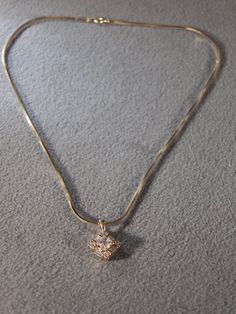 I am offering you this gorgeous vintage sterling silver with yellow gold overlay (stamped) fancy large combination of baguette and round cut genuine cubic zirconia in this bold elegant design pendant charm and necklace chain. It weighs 8 grams . The pendant measures app. 3/4 inch , by a bit under 1/2 inch. The necklace chain is a bold sturdy snake link chain, that measures app. 18 inches long. This exudes both simplicity and elegance at the same time !! Buyer pays all shipping and handling fees, Vintage Tarnish-resistant Chain Necklace With Round Pendant, Vintage Yellow Gold-plated Charm Necklaces, Fancy Pendant, Gold Overlay, Link Necklace, Necklace Chain, Star Necklace, White Topaz, Stone Necklace