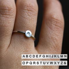 This refined initial ring is made of sterling silver and bears your's dearest initial. The outside surface may be raw and matte or shiny and polished - just state it in the message to the seller during the check-out. This ring ideally passes any style and outfit. The ring is 1 mm thick and is very sturdy although it looks very dainty on the finger. You may order just one ring or few of them - they are stackable and look pretty good together. Each letter on the ring is hand stamped and gives a fe Adjustable Initials Stackable Rings For Everyday, Everyday Adjustable Stackable Rings With Initials, Simple Stackable Initial Ring, Minimalist Sterling Silver Stackable Rings With Initials, Minimalist Hand Stamped Initial Ring As Gift, Adjustable Silver Initial Ring Hand Stamped, Sterling Silver Initial Ring For Everyday, Simple Sterling Silver Stackable Initial Ring, Adjustable Silver Initial Ring For Promise