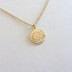 Dainty sun coin choker necklace, Minimalist jewelry, 18k gold chain necklace, Necklaces for women The sun face necklace is made of brass with 18k gold plating. Dimensions 17x14.5mm Your choice of a 13-inch-long checker necklace with an adjustable 2-inch-long extender chain (full length 15 inches). If you need a different length email me. Dainty Gold Plated Tarnish Resistant Medallion Necklace, Dainty Gold Plated Tarnish-resistant Medallion Necklace, Gold Necklace With Sun Design Round Pendant, Gold Sun Design Round Pendant Necklace, Dainty Gold-plated Coin Necklace With Clavicle Chain, Dainty Gold Plated Coin Necklace With Clavicle Chain, Dainty Gold Plated Medallion Charm Necklaces, Dainty Chain Necklace With Coin Pendant, 14k Gold Necklaces With Sun Design