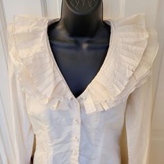 Highest Quality Top, Fit For A Queen 100% Silk Pearlescent Buttons, Ivory Off White Color Layered Tiered Ruffles Stored In A Pet And Smoke Free Home Purchased From Her Nyc Showroom Formal V-neck Blouse With Ruffles, Elegant V-neck Ruffled Blouse, Elegant Ruffled V-neck Blouse, Elegant V-neck Ruffle Blouse, Elegant Blouse With Ruffles And Ruffled Collar, Fitted Ruffle Blouse For Office, Feminine Blouse With Ruffled Collar For Formal Occasions, Formal Fitted Ruffle Tops, Formal Feminine Blouse With Collar