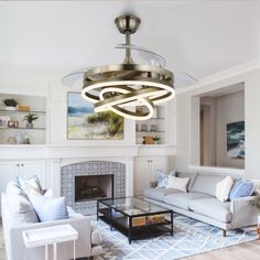 a living room filled with furniture and a fire place in the middle of the room