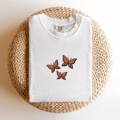 Comfort Colors Butterflies T-Shirt, Embroidered Butterflies Shirt, Cute Butterfly Shirt, Embroidered Insect T-shirt, Custom Butterfly Shirt This embroidered butterflies shirt is everything. Perfect to wear to show your love for butterflies! ✨ 100% Cotton ✨ Pre-shrunk ✨ Relaxed fit Care: Machine wash: warm (max 40C or 105F) Tumble dry: low Do not iron directly on the design REFUNDS AND EXCHANGES All items are made to order using multiple suppliers to ensure quick worldwide shipping. For this reason we are unable to accept returns/exchanges unless there's a defect in the item you've received. Thank you so much for shopping! Please send me a message if you have any questions, concerns or custom requests. Jumper Embroidery, Embroidery Butterfly, Embroidered Butterflies, Butterfly Shirt, Butterfly Shirts, Embroidered Butterfly, Cute Butterfly, Embroidered Shirt, Comfort Colors