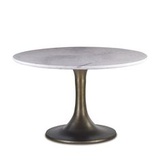 a white marble top table with an antique bronze base and round pedestal, against a white background