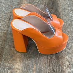 A Brand New Pair Of Orange Chunky Platform Shoes With A Clear Front. Size 38 (7.5) Orange High Heel Platform Shoes, Orange Platform Heels With High Heel, Orange Platform High Heels, Orange Block Heels With Padded Heel, Polyurethane Heels With Stacked Heel And Round Toe, Bold Heels With Stacked Block Heel, Polyurethane Heels With Stacked Block Heel, Bold Stacked Heel Heels With Round Toe, Bold Block Heels With Sculpted Heel