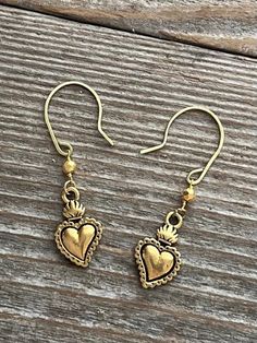 These gold Milagros earrings have a faceted pyrite stone on gold filled chain. The heart is gold finished Pewter. Symbolic Pierced Dangle Jewelry, Bohemian Drop Earrings For Anniversary, Spiritual Style Drop Earrings For Wedding, Symbolic Drop Earrings Jewelry Gift, Symbolic Drop Earrings Jewelry As Gift, Symbolic Dangle Earrings As Gift, Symbolic Drop Earrings As A Gift, Symbolic Teardrop Jewelry For Gifts, Spiritual Dangle Earrings As Gift