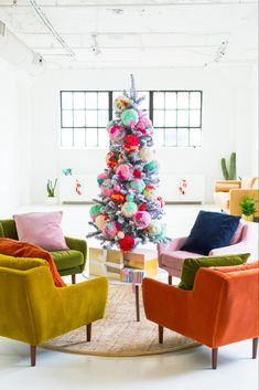 the instagram christmas tree is decorated with colorful pom - poms and balls