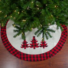 a red and black plaid christmas tree skirt