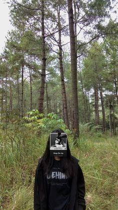 a person standing in the middle of a forest