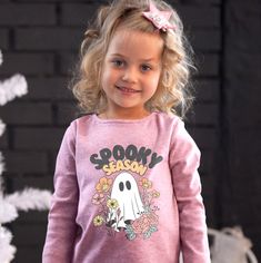 Playful Cartoon Print T-shirt For Fall, Novelty Long Sleeve T-shirt With Graphic Print, Playful Long-sleeve T-shirt With Graphic Print, Playful Long-sleeved T-shirt With Graphic Print, Playful Fall T-shirt With Cartoon Print, Pink Long Sleeve T-shirt With Character Print, Playful Long Sleeve T-shirt With Character Print, Fun Long Sleeve T-shirt With Cartoon Print, Halloween Character Print Pink Top