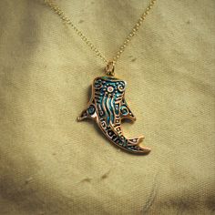 This gold and diamond Whale Shark will be hand made for you in the United Kingdom. Please allow up to 28 days for it to be completed. Blue and gold Whale Shark necklace, solid gold whale shark tattoo design pendant.This solid 9ct yellow gold whale shark pendant has been given a high-carat gold coating, decorated with a blue patina reminiscent of maritime tattoo ink and set with a brightly sparkling little diamond. The design was inspired by the art of the coastal communities that have lived in harmony with these magnificent creatures for thousands of years.Whale Sharks are the largest of all fish growing up to 14m (46 ft) long, yet they are quite harmless to humans. Swimming with Whale Sharks is often described as the highlight of many tropical adventures.This substantial pendant measures Whale Shark Tattoo Design, Shark Tattoo Design, Tattoo Whale, Whale Shark Tattoo, Gold Whale, Whale Jewelry, Shark Pendant, Swimming With Whale Sharks, Whale Sharks